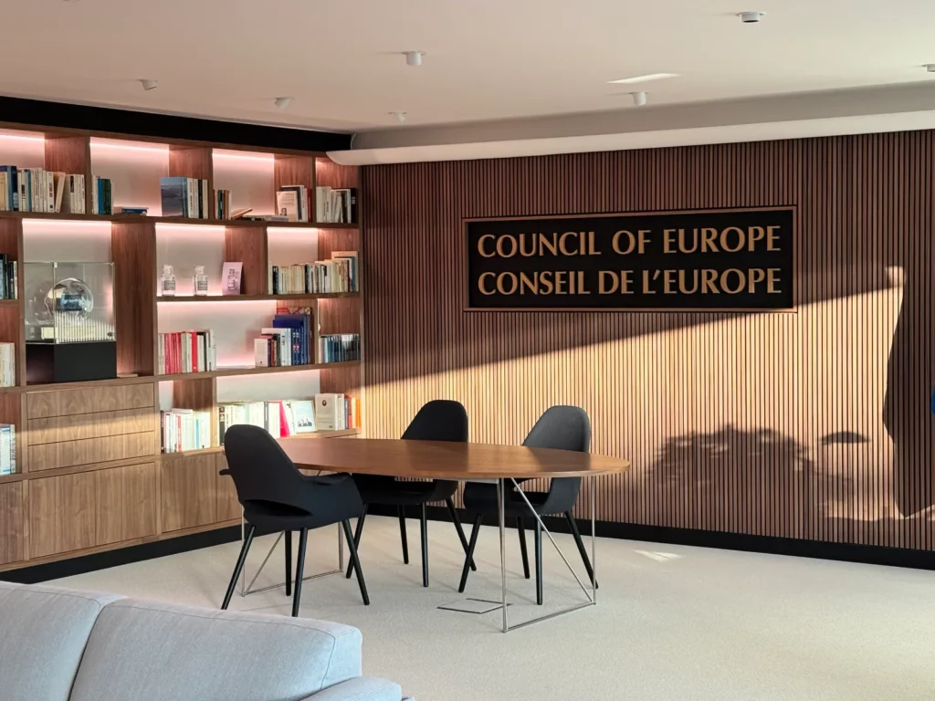 Meeting room in the office of the Secretary General of the Council of Europe, Strasbourg, with bookshelves and the inscription “Council of Europe – Conseil de l'Europe”