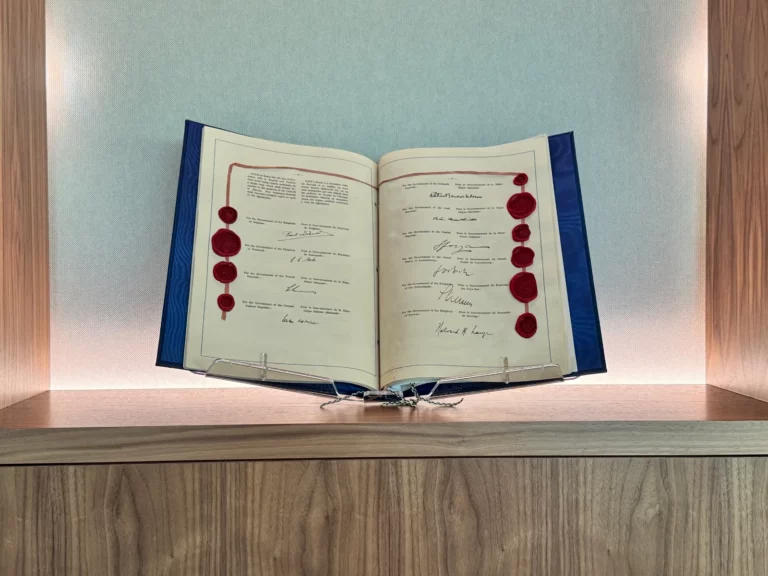 Copy of the European Convention on Human Rights open at the page of signatures and wax seals (Rome, 4 November 1950)