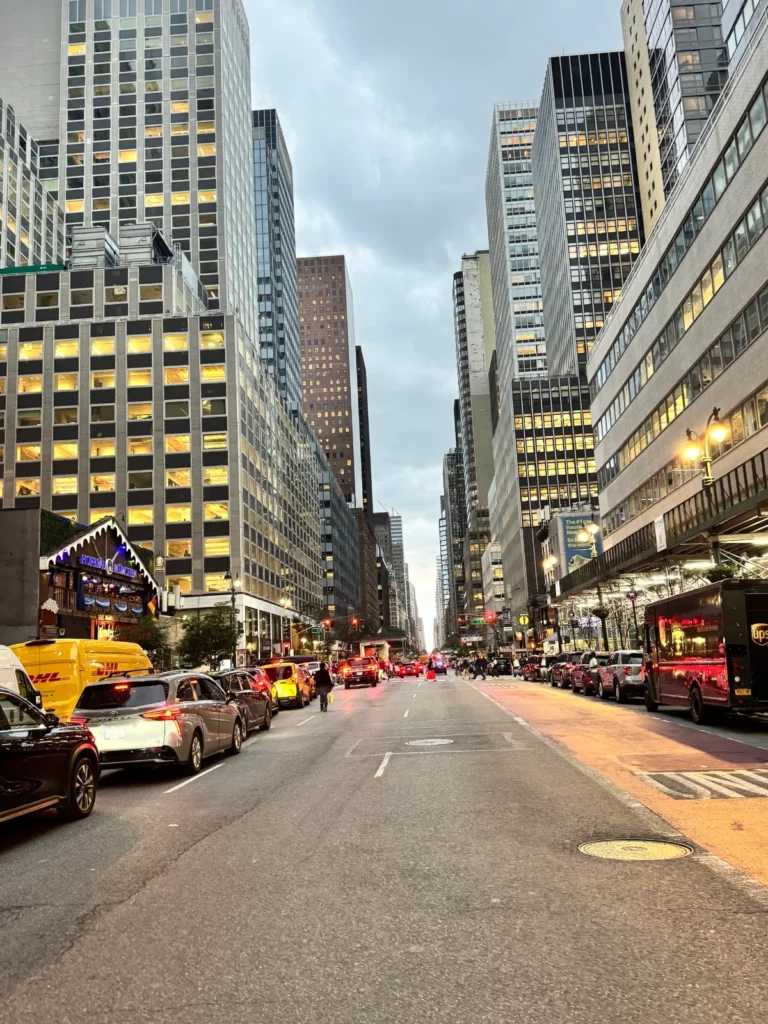 A Manhattan avenue lined with skyscrapers at dusk, New York, September 2026